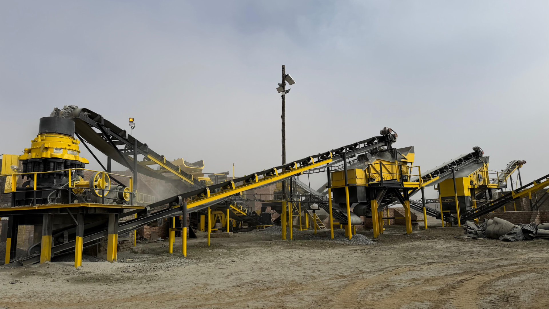 Umvubu Crushers processing plant with yellow crushers and conveyor belts