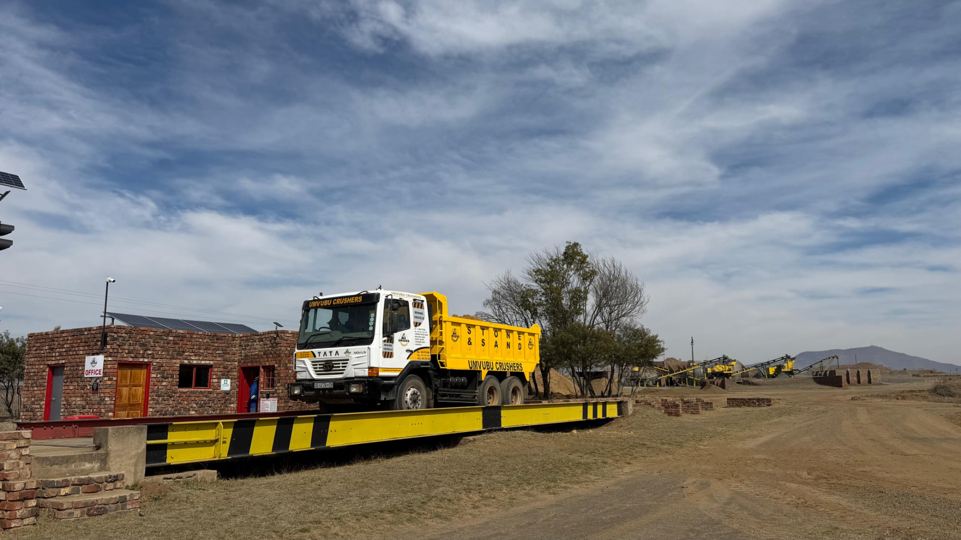 Branded Umvubu Crushers tipper truck on the weighbridge at the quarry